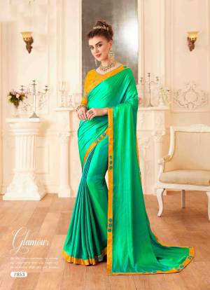 Celebrate This Festive Season Wearing This Beautiful Designer Saree In Sea Green Color Paired With Contrasting Musturd Yellow Colored Blouse. This Saree And Blouse Are Silk Based Beautified With Embroidery Over The Blouse And Lace Border.