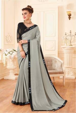 Rich And Elegant Looking Designer Saree In Grey Color Paired With Black Colored Blouse. This Saree Is Fabricated On Soft Silk Paired With Art Silk Fabricated Blouse. Buy This Designer Saree Now.