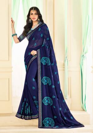 Enhance Your Personality Wearing This Saree In Navy Blue Color Paired With Blue Colored Blouse. This Saree Is Georgette Based Paired With Brocade Fabricated Blouse. Its Fabric Ensures Superb Comfort All Day Long. 
