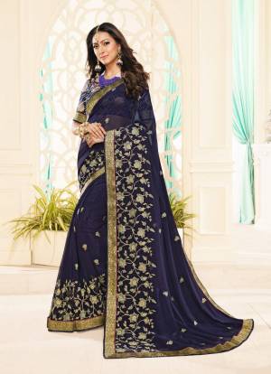 Enhance Your Personality Wearing This Saree In Navy Blue Color Paired With Navy Blue Colored Blouse. This Saree Is Georgette Based Paired With Brocade Fabricated Blouse. Its Fabric Ensures Superb Comfort All Day Long. 