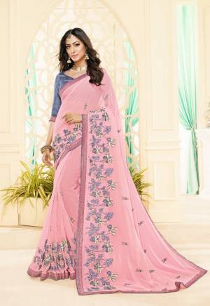 Look Pretty Wearing This Designer Saree In Pink Color Paired With Contrasting Grey Colored Blouse. This Saree Is Georgette Based Paired With Brocade Fabricated Blouse. Its Pretty Color Pallete And Design Will Earn You Lots Of Compliments From Onlookers. 