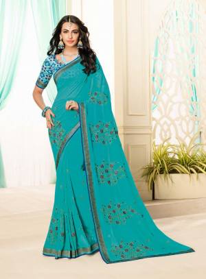 For Your Semi-Casual Wear, Grab This Saree In Blue Color Paired With Blue Colored Blouse. This Saree Is Georgette Based Paired With Brocade Fabricated Blouse. Both Its Fabrics Ensures Superb Comfort All Day Long.