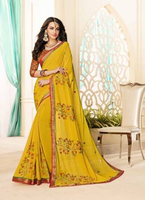 Celebrate This Festive Season Wearing This Yellow Colored Saree Paired With Contrasting Red Colored Blouse. This Saree Is Fabricated On Georgette Paired With Brocade Fabricated Blouse. Grab This Now.