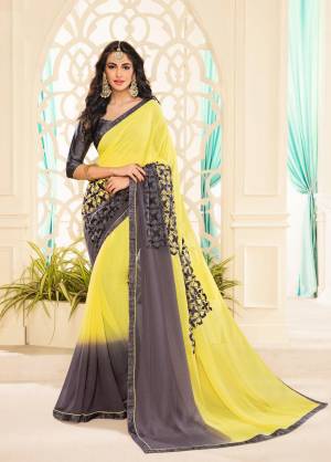 Celebrate This Festive Season Wearing This Yellow And Grey Colored Saree Paired With Dark Grey Colored Blouse. This Saree Is Fabricated On Georgette Paired With Brocade Fabricated Blouse. Grab This Now.