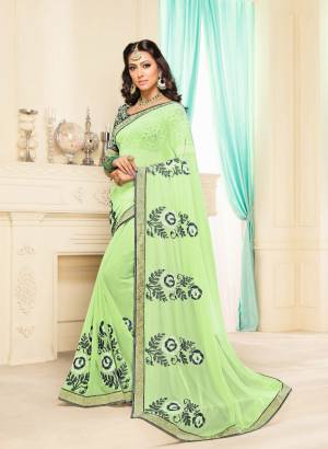 This Season Is About Subtle Shades And Pastel Play, So Grab This Designer Saree In Pastel Green Color Paired With Grey And Green Colored Blouse. This Saree Is Georgette Based Paired With Brocade Fabricated Blouse. Buy Now.