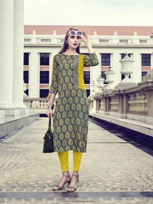 In Your College Or Your Work Place, This Readymade Grey Colored Kurti IS Suitable For All. IT IS Fabricated On Rayon Beautified With Prints All Over It. Buy Now.