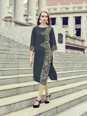 For A Patterned Look, Grab This Readymade Kurti In Dark Green Color Fabricated On Rayon. Its Fabric Ensures Superb Comfort All Day Long And Its Easy To Care For And Durable. 