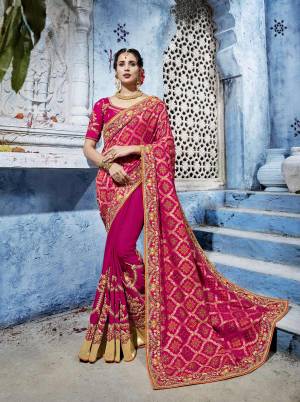 Bright And Visually Appealing Color Is Here With This Designer Saree In Dark Pink Color Paired With Dark Pink Colored Blouse. This Saree Is Fabricated On Jacquard Silk And Soft Silk Paired With Art Silk Fabricated Blouse. This Designer Saree Will Earn You Lots Of Compliments From Onlookers.