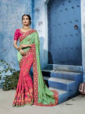 Very Pretty Color Pallete Is Here With This Designer Saree In Light Green And Pink Color Paired With Dark Pink Colored Blouse. This Saree And Blouse Are Silk Based Beautified With Weave And Embroidery. Buy Now.