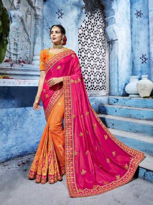 Bright And Visually Appealing Color Is Here With This Designer Saree In Dark Pink And Orange Color Paired With Orange Colored Blouse. This Saree Is Fabricated On Soft Silk Paired With Art Silk Fabricated Blouse. This Designer Saree Will Earn You Lots Of Compliments From Onlookers.
