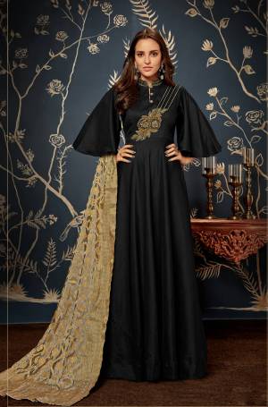 Enhance Your Personality Wearing This designer Readymade Gown In Black Color Paired With Grey And Golden Colored Dupatta. Its Top Has Beautiful Bell Sleeve Pattern With Embroidered Yoke Which Will earn You Lots Of Compliments From Onlookers. 
