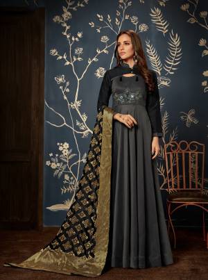 For A Bold and Beautiful Look, Grab This Designer Readymade Gown In Black Color Paired With Black Colored Dupatta. This Gown And Dupatta Are Silk Based Beautiifed With Embroidery And Weave. Buy Now.