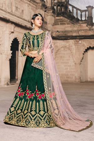Celebrate This Festive And Wedding Season With This Heavy Designer Lehenga Choli In Dark Green Color Paired With Contrasting Pastel Pink Colored Dupatta. Its Blouse And Lehenga Are Fabricated On Art Silk Paired With Net Fabricated Dupatta. Buy This Soon.