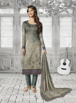 Enhance Your Personality Wearing this Designer Semi-Stitched Suit In Grey Color Paired With Dark Grey Bottom And Grey Colored Dupatta. Its Top Is Fabricated On Soft Cotton Paired With Cotton Bottom And Chiffon Dupatta. It Is Beautified With Prints And Resham Embroidery And Stone Work. 