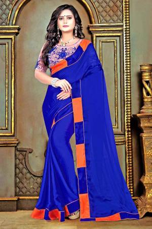Shine Bright In This Attractive Royal Blue Colored Saree Paired With Contrasting Orange Colored Blouse. This Saree Is Fabricated On Satin Checks Paired With Net And Satin Fabricated Blouse. Both Its Fabric Ensures Superb Comfort All Day Long. Buy Now.