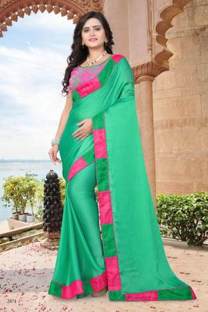 Celebrate This Festive Season Wearing This Designer Saree In Green Color Paired With Green Colored Blouse. This Saree Is Fabricated On Satin Checks Paired With Net And Satin Fabricated Blouse.  Buy This Saree Now.