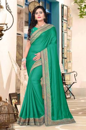Grab This Beautiful Designer Saree In Green Color Paired with Green Colored Blouse. This Saree And Blouse Are Silk Baased Beautified With Heavy Embroidered Lace Border And Blouse. Also Its Silk Fabric Gives A Rich Look To Your Personality. 