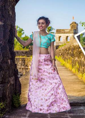 A Very Pretty Color Pallete Is Here According To The Girl, Grab This Designer Lehenga Choli In Turquoise Blue Colored Blouse, Paired With Baby Pink Colored Lehenga And Dupatta. This Silk Based Heavy Embroidered Lehenga Choli Is Paired With Net Fabricated Dupatta. 