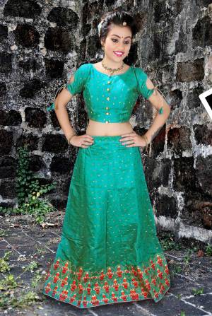 Simple And Elegant Looking Designer Lehenga Choli Is Here In Green Color Paired With Contrasting Rani Pink Colored Dupatta. Its Blouse And Lehenga Are Fabricated On Jacquard Silk Paired With Net Fabricated Dupatta. 
