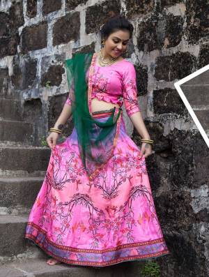 Here Is A Very Pretty Looking Designer Lehenga Choli In Pink Color Paired With Contrasting Dark Green Colored Dupatta. Its Blouse And Lehenga Are Satin Silk Based Paired With Net Fabricated Dupatta. 