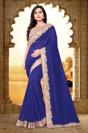 Grab This Beautiful And Attractive Looking Saree In Royal Blue Color Paired With Contrasting Baby Pink Colored Blouse. This Saree Is And Blouse Are Silk Based Beautified With Heavy Embroidery Over The Blouse and Saree Lace Border.