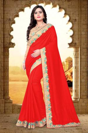 Grab This Beautiful And Attractive Looking Saree In Red Color Paired With Contrasting Beige Colored Blouse. This Saree Is And Blouse Are Silk Based Beautified With Heavy Embroidery Over The Blouse and Saree Lace Border.