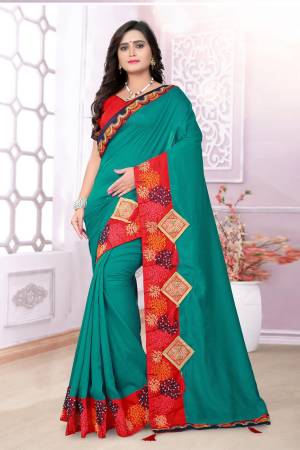 Grab This Beautiful Silk Based Saree In Teal Blue Color Paired With Contrasting Red Colored Blouse. This Saree And Blouse Are Fabricated On Art Silk Beautified With Embroidery And Patch Work. Also The Silk Fabric Gives A Rich Look To Your Personality. Buy Now.