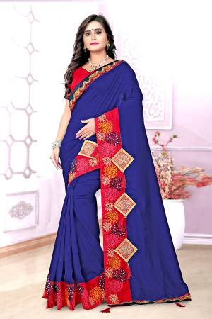 Grab This Beautiful Silk Based Saree In Royal Blue Color Paired With Contrasting Red Colored Blouse. This Saree And Blouse Are Fabricated On Art Silk Beautified With Embroidery And Patch Work. Also The Silk Fabric Gives A Rich Look To Your Personality. Buy Now.