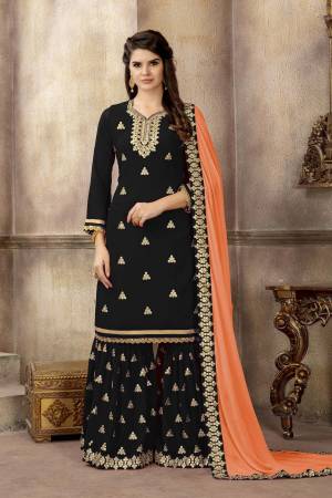For A Bold And Beautiful Look, Grab This Designer Sharara Suit In Black Color Paired With Black Colored Sharara And Orange Colored Dupatta. Its Top And Bottom Are Fabricated On Georgette Paired With Chiffon Dupatta. Buy This Designer Suit Now.
