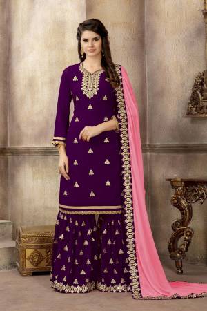 Look Beautiful In This Lovely Color Pallete Wearing This Designer Sharara Suit In Purple Color Paired With Contrasting Pink Colored Dupatta. Its Top And Bottom Are Fabricated On Georgette Paired With Chiffon Dupatta. 