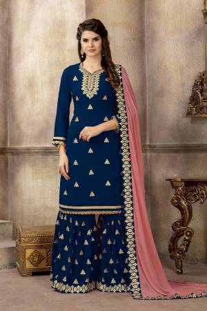 Shine Bright Wearing This Designer Sharara Suit In Royal Blue Color Paired With Contrasting Baby Pink Colored Dupatta. This Pretty Suit Is Georgette Based Paired With Chiffon Dupatta. Also Its Fabric Enures Superb Comfort Throughout The Gala.