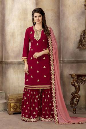 Adorn The Pretty Angelic Look Wearing This Designer Sharara Suit In Red Color Paired With Contrasting Baby Pink Colored Dupatta. Its Top And Bottom Are Georgette Based With heavy Embroidery Paired With Chiffon Fabricated Dupatta.