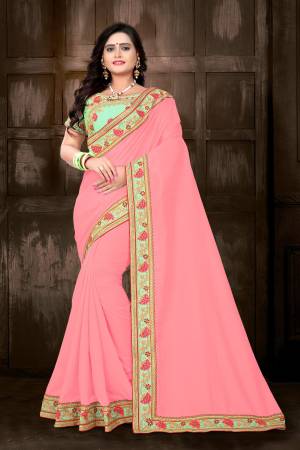 Celebrate This Festive Season With Designer Saree In Bright Color Pallete. This Pretty Saree Is In Pink Color Paired With Contrasting Light Green Colored Blouse. This Saree And Blouse Are Silk Based Which Also Gives An Enhanced Look To Your Personality. 