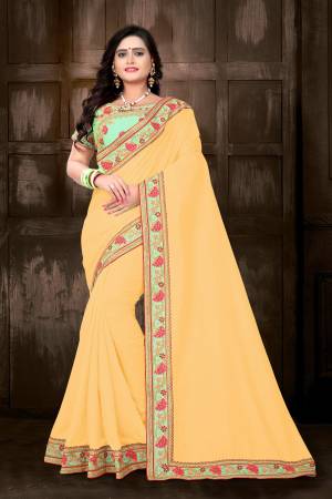 Celebrate This Festive Season With Designer Saree In Bright Color Pallete. This Pretty Saree Is InMusturd Yellow Color Paired With Contrasting Light Green Colored Blouse. This Saree And Blouse Are Silk Based Which Also Gives An Enhanced Look To Your Personality. 