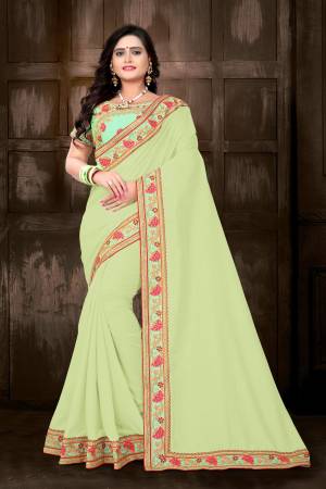 Celebrate This Festive Season With Designer Saree In Bright Color Pallete. This Pretty Saree Is In Mint Green Color Paired With Light Green Colored Blouse. This Saree And Blouse Are Silk Based Which Also Gives An Enhanced Look To Your Personality. 