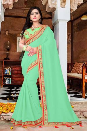 Add This Very Pretty And Attractive Looking Saree To Your Wardrobe For Upcoming Festive And Wedding Season. This Saree Is In Light Green Color Paired With Light Green Colored Blouse. This Saree And Blouse Are Silk Based Which Give A Rich And Beautiful Look To Your Personality. 