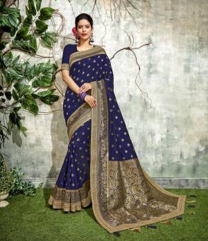 Ornate with gold weaves and exquisite motifs , this Navy blue silk saree lends a sense of
traditional harmony.