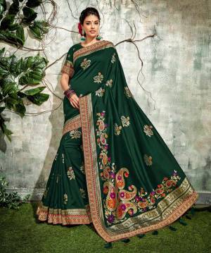 Flaunt this vivacios, culture-rich weaved silk saree in the most regal tone of green in a queen-like poise to look glorious. 