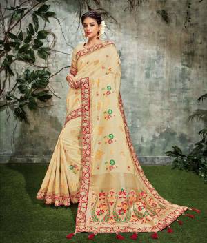Classic ivory tones with intricate detailing in the silk weaves is a soothing and prisitine
look for the festivities.