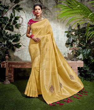 Behold a sunshine-like , dignified look this wedding/festive season in this Yellow saree with rani pink blouse . Add statement choker to uplift the look. 