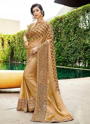 Simple And Elegant Looking Designer Saree Is Here In Beige Color Paired With Beige Colored Blouse. This Saree And Blouse Are Silk Based Beautified With Heavy Embroidery Giving It An Attractive Look.