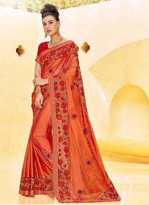 Celebrate This Festive Season Wearing This Designer And Attractive Looking Saree In Orange Color Paired With Contrasting Red Colored Blouse. This Saree Is Fabricated On Satin Georgette Paired With Art Silk Fabricated Blouse. Buy Now.