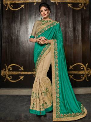 Flaunt a new ethnic look wearing this Sea green and beige color two tone silk and silk fabrics saree. this party wear saree won't fail to impress everyone around you. this gorgeous saree featuring a beautiful mix of designs. Its attractive color and designer heavy embroidered design, Flower patch design, zari work, stone design, beautiful floral design work over the attire & contrast hemline adds to the look. Comes along with a contrast unstitched blouse.