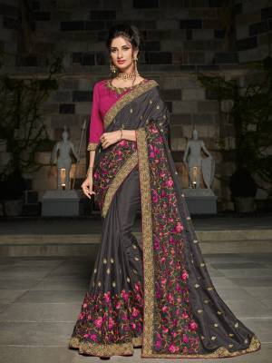 you Look striking and stunning after wearing this Dark Green color silk fabrics saree. look gorgeous at an upcoming any occasion wearing the saree. this party wear saree won't fail to impress everyone around you. Its attractive color and designer heavy embroidered design, designer blouse, beautiful floral design work over the attire & contrast hemline adds to the look. Comes along with a contrast unstitched blouse.