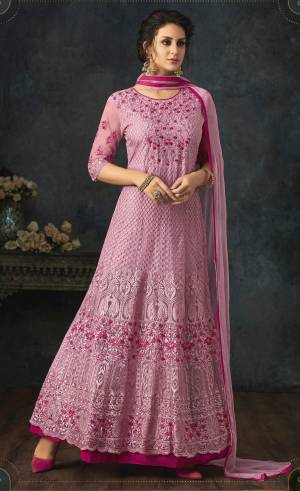 Look Pretty In This Designer Floor Length Suit In Pink Color Paired With Pink Colored Bottom And Dupatta. Its Top Is Fabricated On Net With Heavy Embroidery All Over Paired With Santoon Bottom And Chiffon Dupatta. 