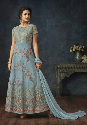 Here A Very Pretty Shade With This Designer Floor Length Suit In Light Blue Color Paired With Light Blue Colored Bottom And Dupatta. Its Top Is Net Based Paired With Santoon Bottom And Chiffon Dupatta. 
