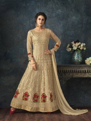 Simple And Elegant looking Designer Floor Length Suit Is Here In Beige Color Paired With Beige Colored Bottom And Dupatta. Its Top Is Net Based Paired With Santoon Bottom And Chiffon Dupatta. Buy Now.