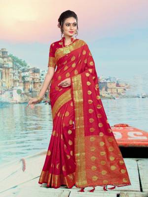 Add This Lovely Attractive Looking Saree In Red Color Paired With Red Colored Blouse. This Lovely Saree And Blouse Are Silk based Which Give A Rich And Elegant Look To Your Personality. 