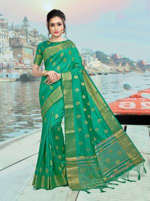 Add This Lovely Attractive Looking Saree In Green Color Paired With Green Colored Blouse. This Lovely Saree And Blouse Are Silk based Which Give A Rich And Elegant Look To Your Personality. 