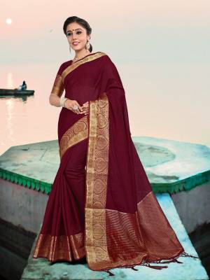 This Festive Season, Adorn A Rich And Elegant Looking Silk Based Saree In Maroon Color Paired With Maroon Colored Blouse. Its Fabric And Color Will Earn You Lots Of Compliments From Onlookers. 